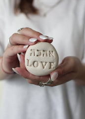 Ceramic stone with 'Love' in Hebrew (אהבה) and English – handmade and perfect for meaningful gifting or decor